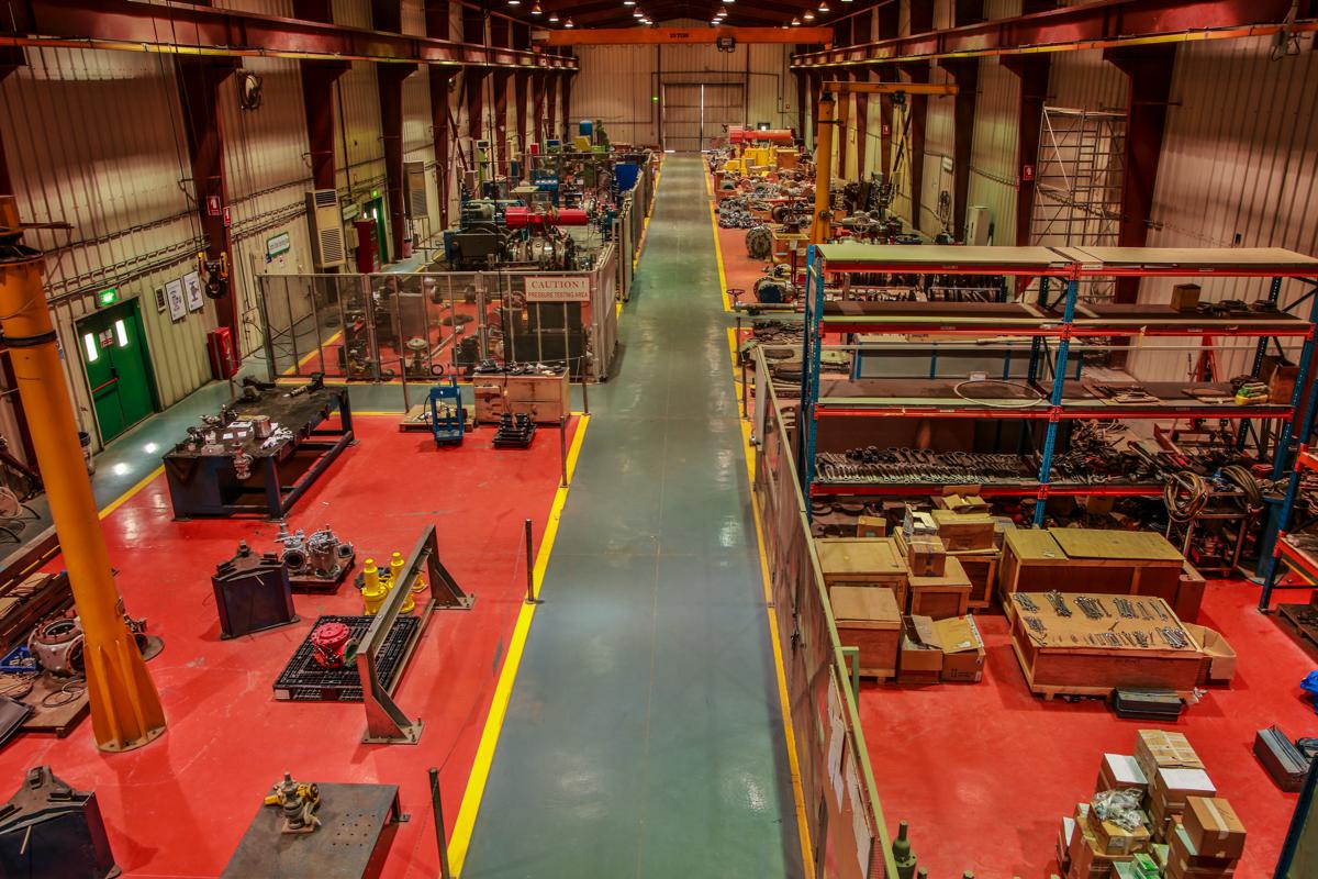 A high view over the workshop, the pressure testing area enclosed on the left